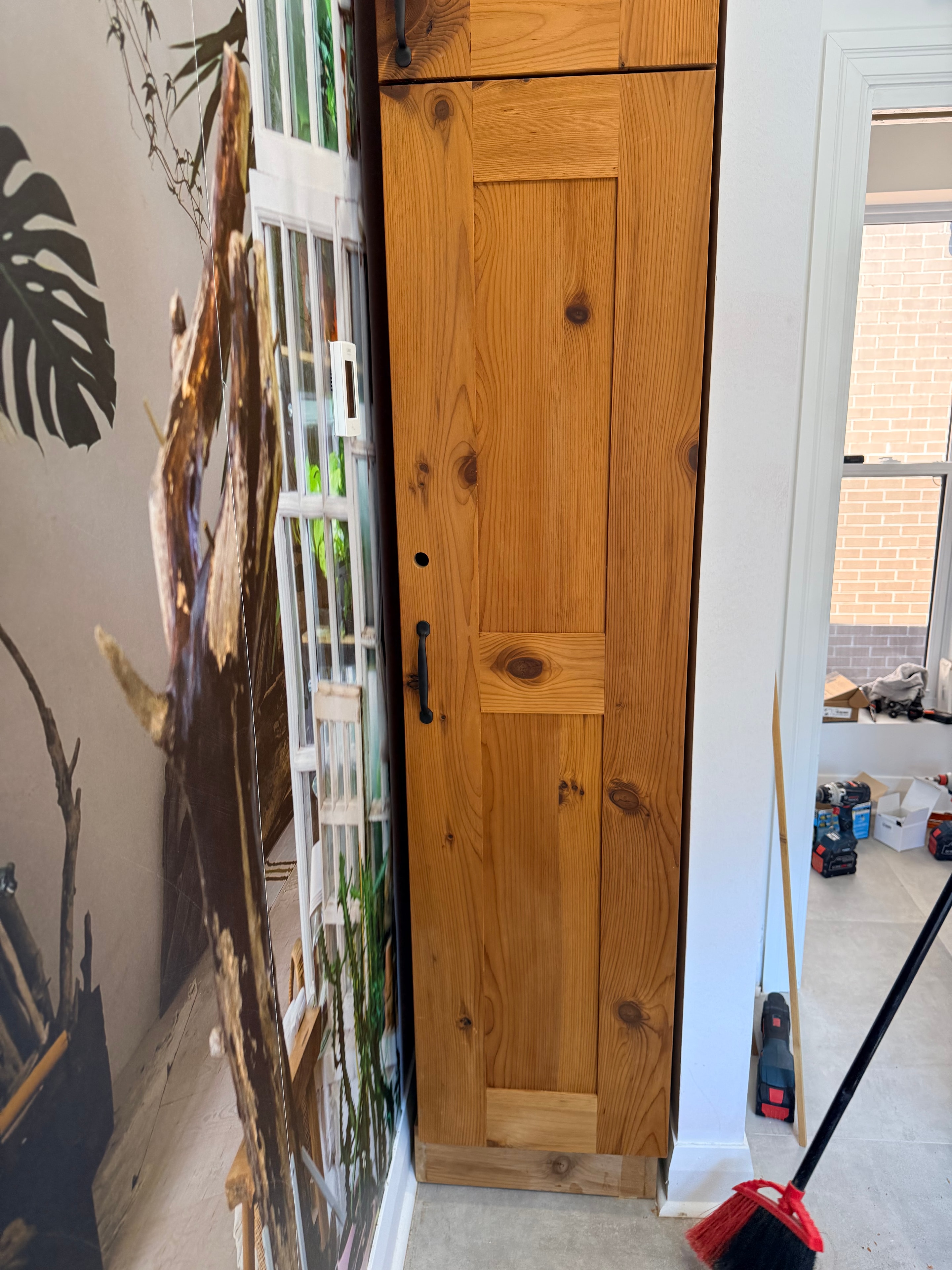 Pine lower cabinetry installation