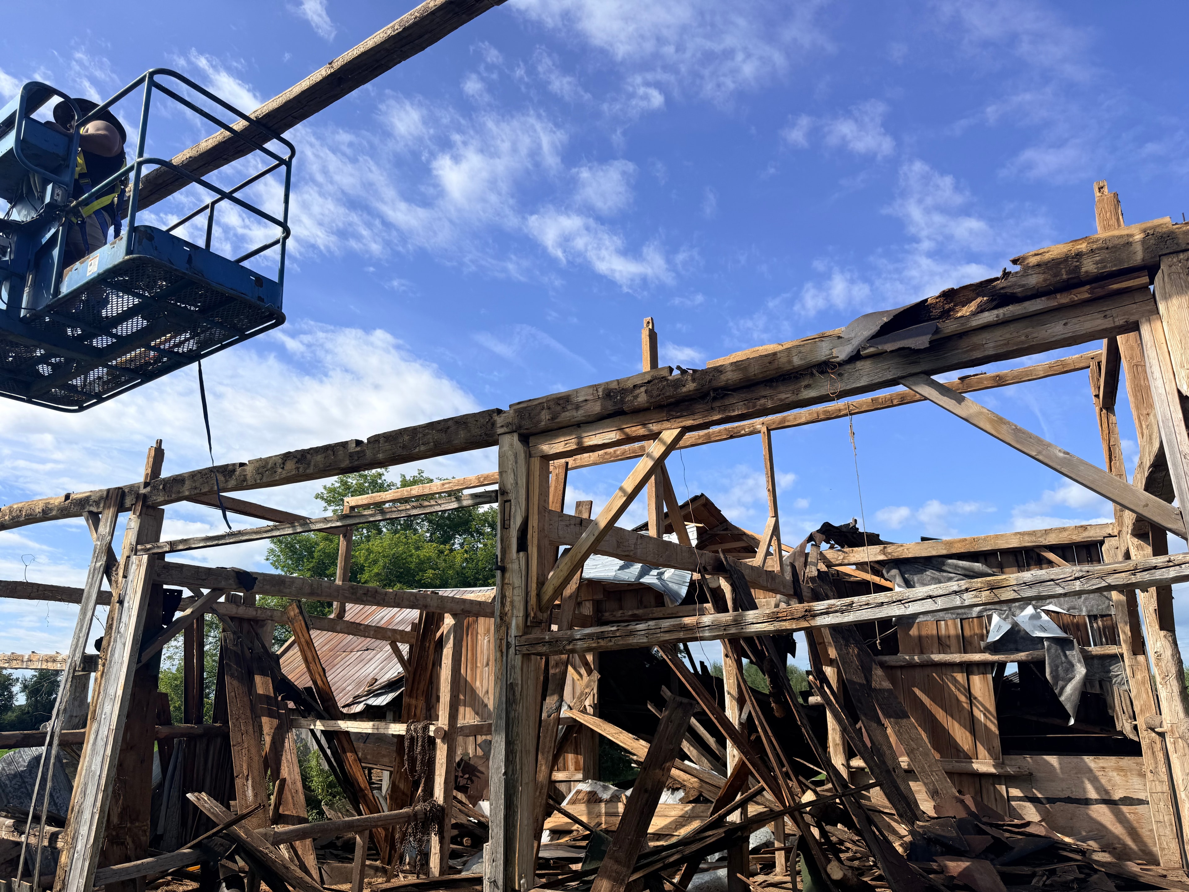Reclaimed barn timber salvage with crane